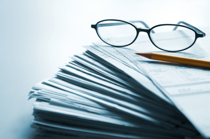 Glasses on a stack of papers